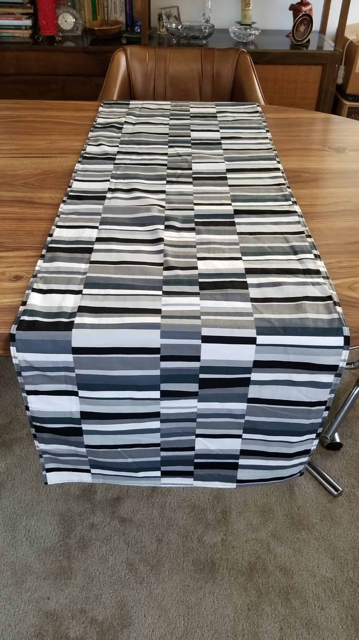 This Shades of Gray/Coffee Reversible Runner is made with love by The Creative Soul Sisters! Shop more unique gift ideas today with Spots Initiatives, the best way to support creators.