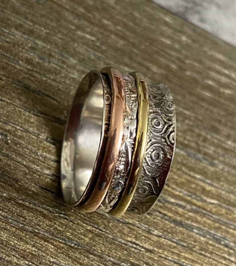 This Sterling silver three tone spinner fidget rings for mens women is made with love by EARTH KARMA! Shop more unique gift ideas today with Spots Initiatives, the best way to support creators.