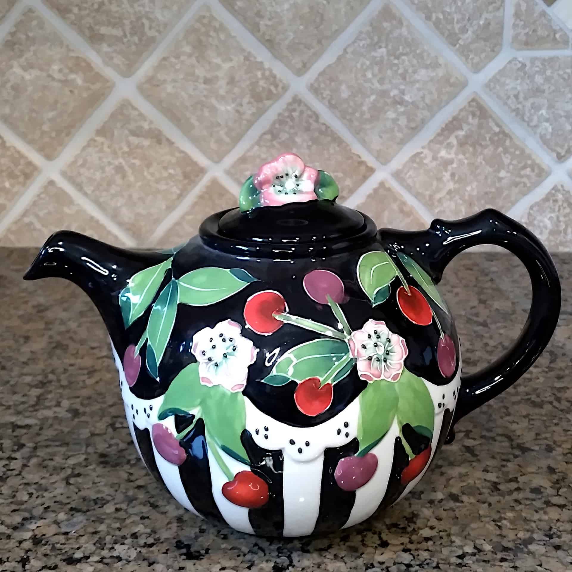 This Cherry Floral Teapot Kitchen Decorative Collectable Flower Blue Sky Goldminic is made with love by Premier Homegoods! Shop more unique gift ideas today with Spots Initiatives, the best way to support creators.