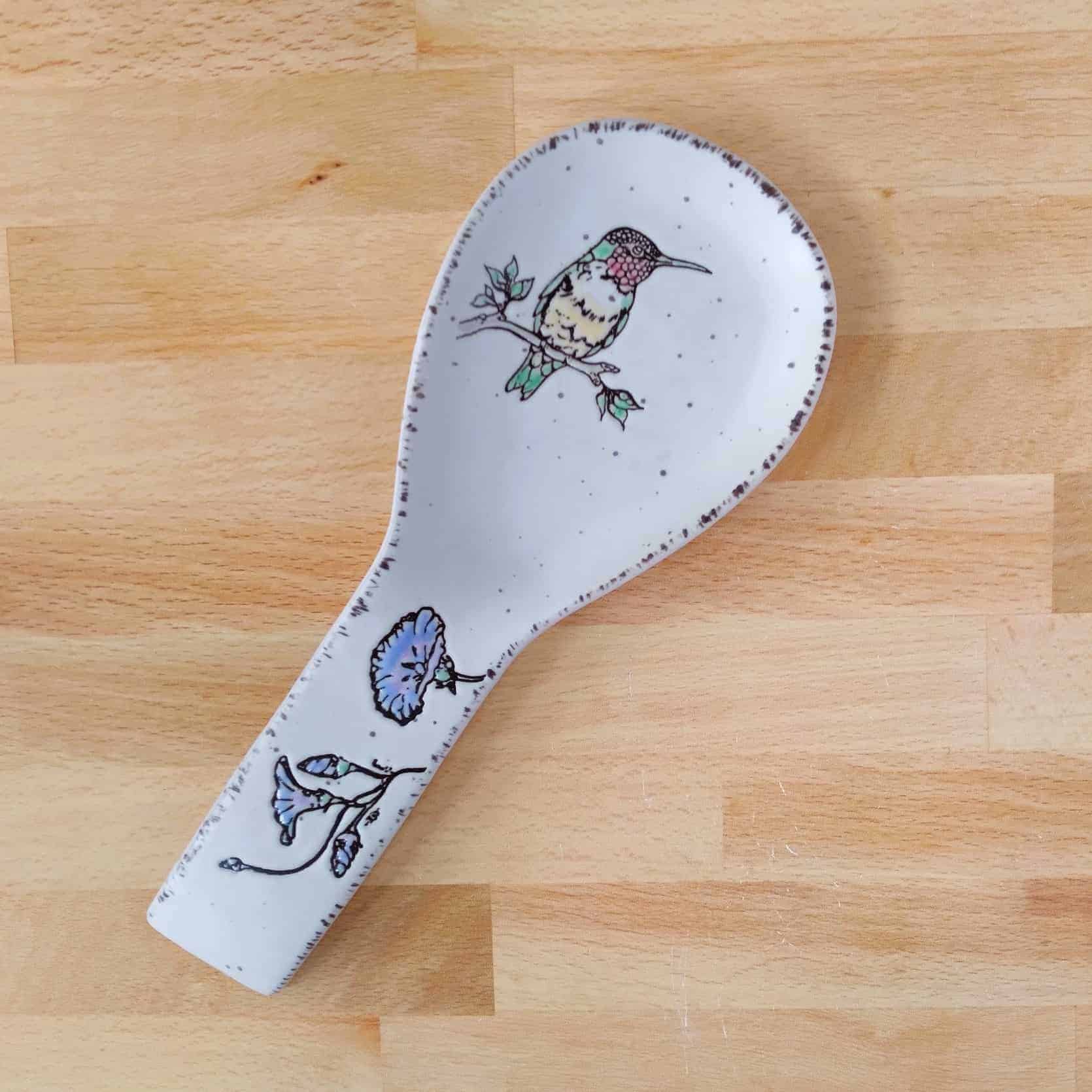 This Hummingbird Spoon Rest Ceramic by Blue Sky is made with love by Premier Homegoods! Shop more unique gift ideas today with Spots Initiatives, the best way to support creators.