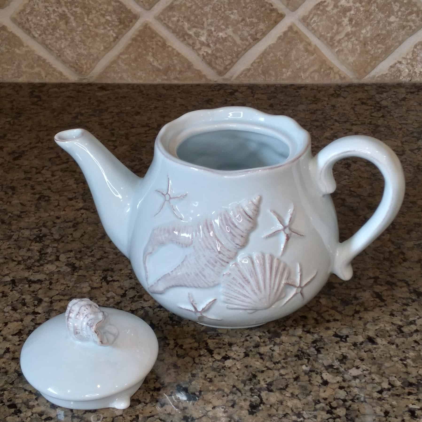 This Laguna Coastal Shell Teapot Blue Decorative Sea Life Home Decor by Blue Sky is made with love by Premier Homegoods! Shop more unique gift ideas today with Spots Initiatives, the best way to support creators.