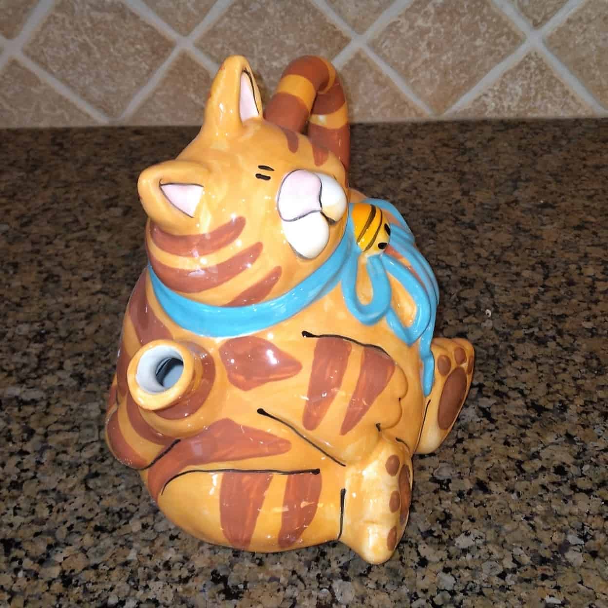 This Orange Cat Ceramic Teapot Decorative Kitchen Decor Blue Sky by Lynda Corneille is made with love by Premier Homegoods! Shop more unique gift ideas today with Spots Initiatives, the best way to support creators.