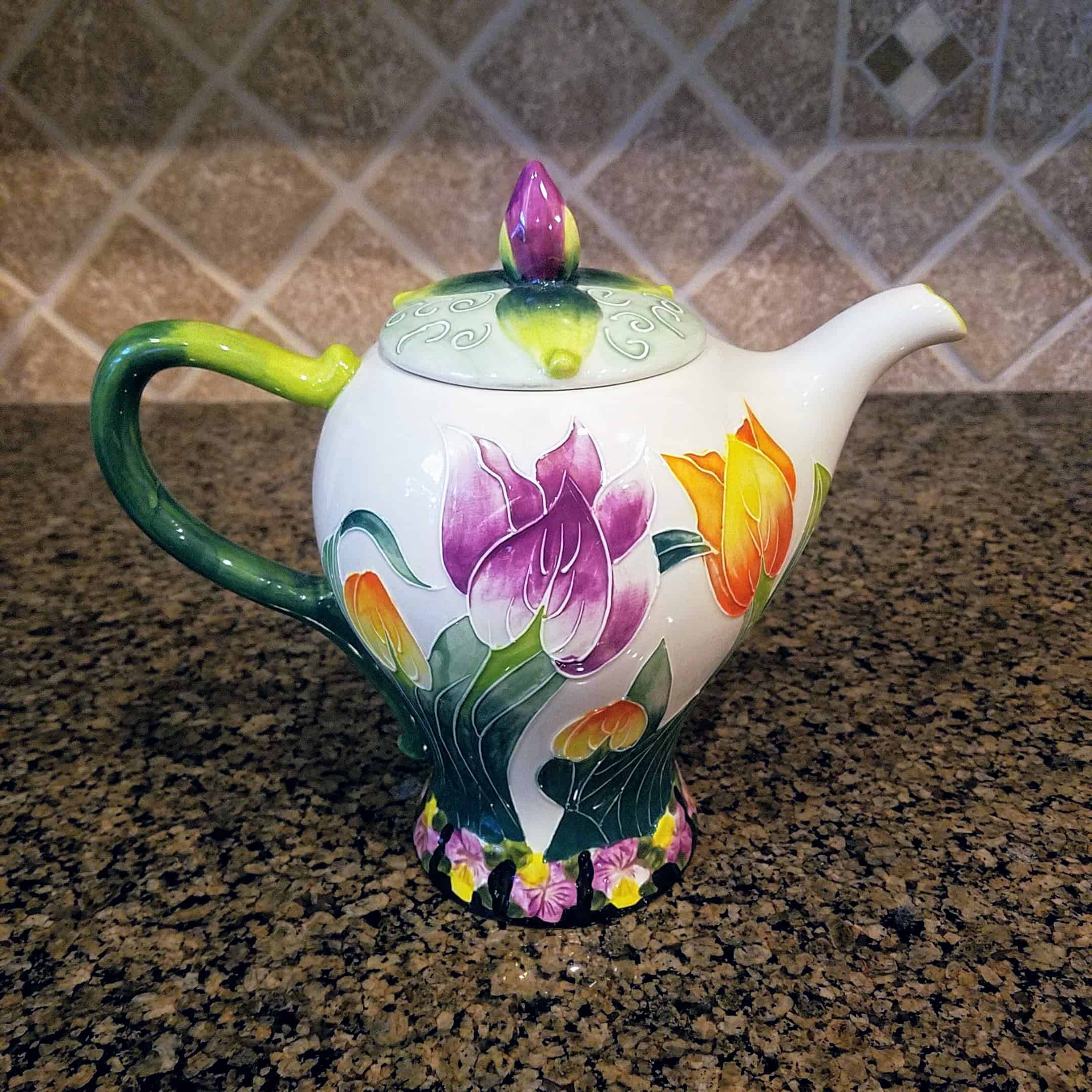 This Tulip Teapot Ceramic Kitchen Decorative Collectable Blue Sky Heather Goldminic is made with love by Premier Homegoods! Shop more unique gift ideas today with Spots Initiatives, the best way to support creators.