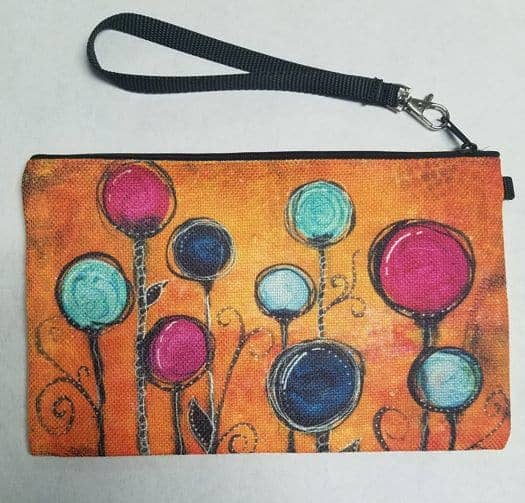 This Wristlet "Circus" is made with love by Studio Patty D! Shop more unique gift ideas today with Spots Initiatives, the best way to support creators.