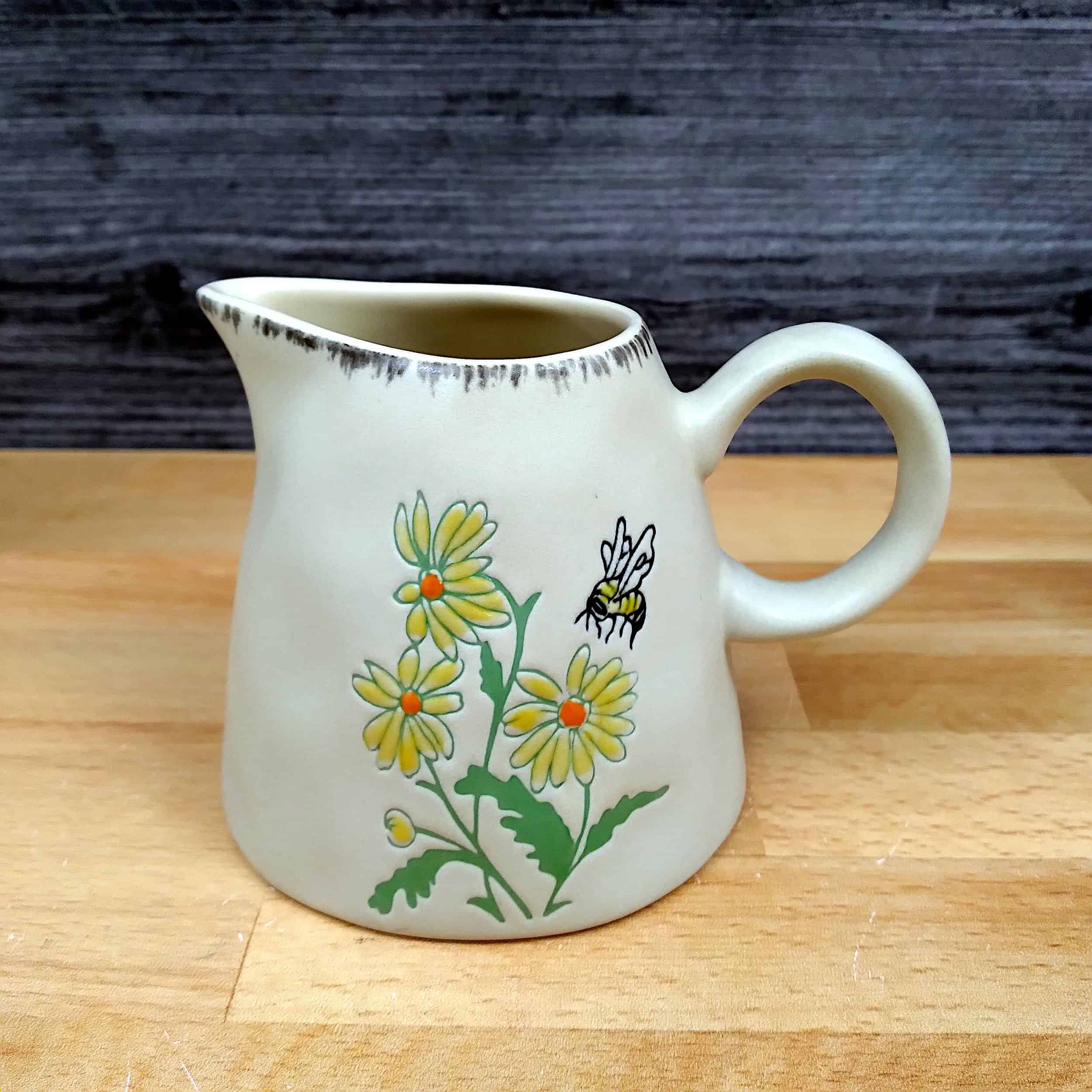 This Bumble Bee and Flower Sugar Bowl and Creamer Set Decorative by Blue Sky is made with love by Premier Homegoods! Shop more unique gift ideas today with Spots Initiatives, the best way to support creators.