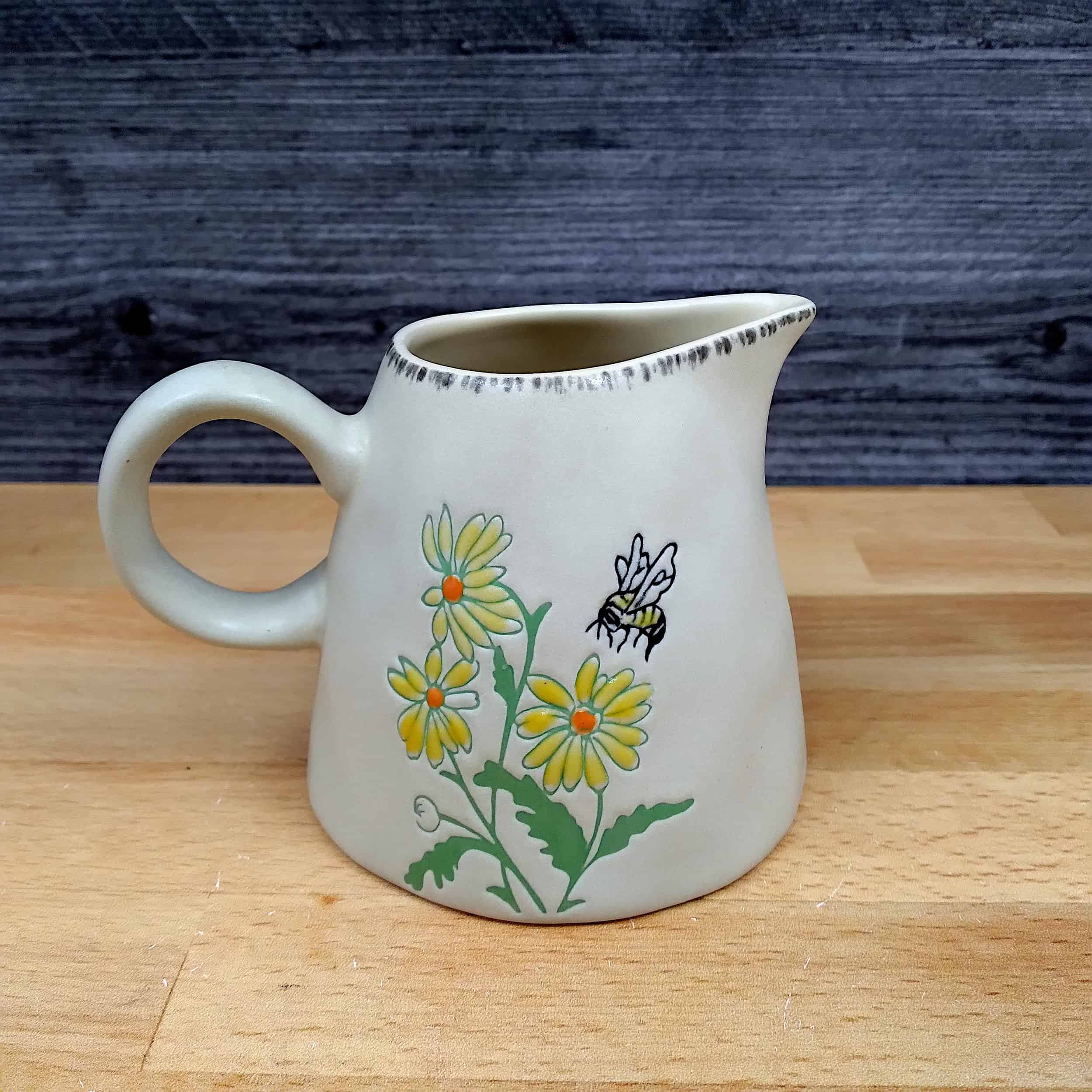 This Bumble Bee and Flower Sugar Bowl and Creamer Set Decorative by Blue Sky is made with love by Premier Homegoods! Shop more unique gift ideas today with Spots Initiatives, the best way to support creators.