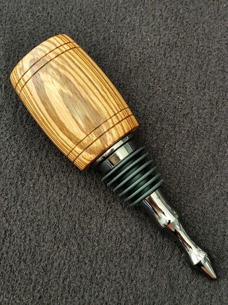 This Zebrawood Barrel Black Titanium Nitride Wine Bottle Stopper is made with love by Blackbear Designs! Shop more unique gift ideas today with Spots Initiatives, the best way to support creators.