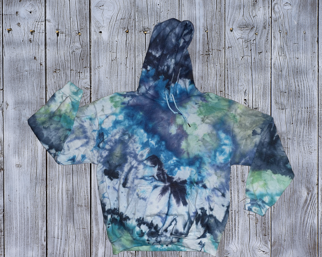 This Large Ice Dyed Hoodie is made with love by Rainbow Sunshine Dye by Sol! Shop more unique gift ideas today with Spots Initiatives, the best way to support creators.