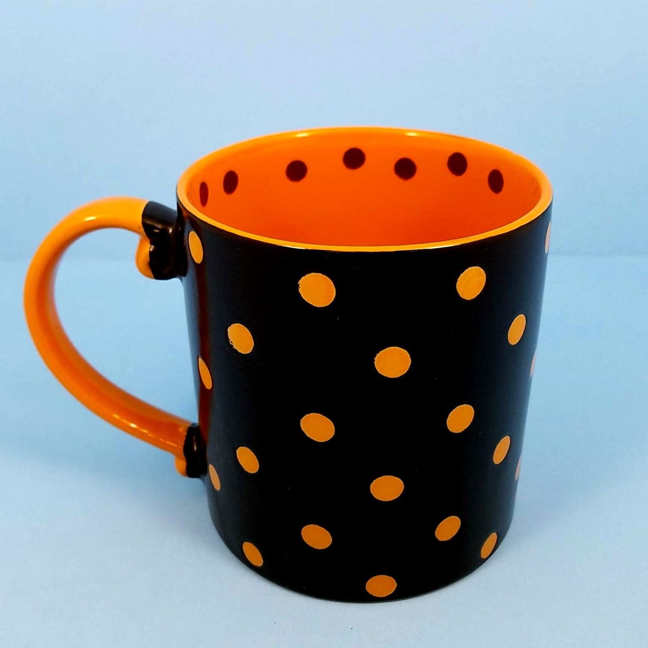 This Halloween Cat Mug Cup Black & Orange Pen Pencil or Plant Holder 21oz (596ml) is made with love by Premier Homegoods! Shop more unique gift ideas today with Spots Initiatives, the best way to support creators.