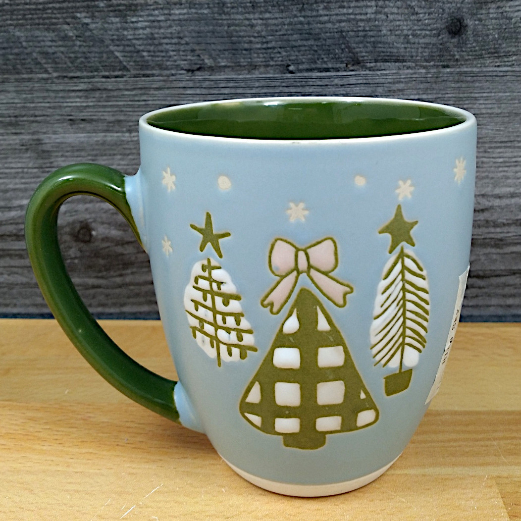 This Christmas Tree Holiday Coffee Mug Green & Blue 17oz 455ml Embossed Cup Blue Sky is made with love by Premier Homegoods! Shop more unique gift ideas today with Spots Initiatives, the best way to support creators.