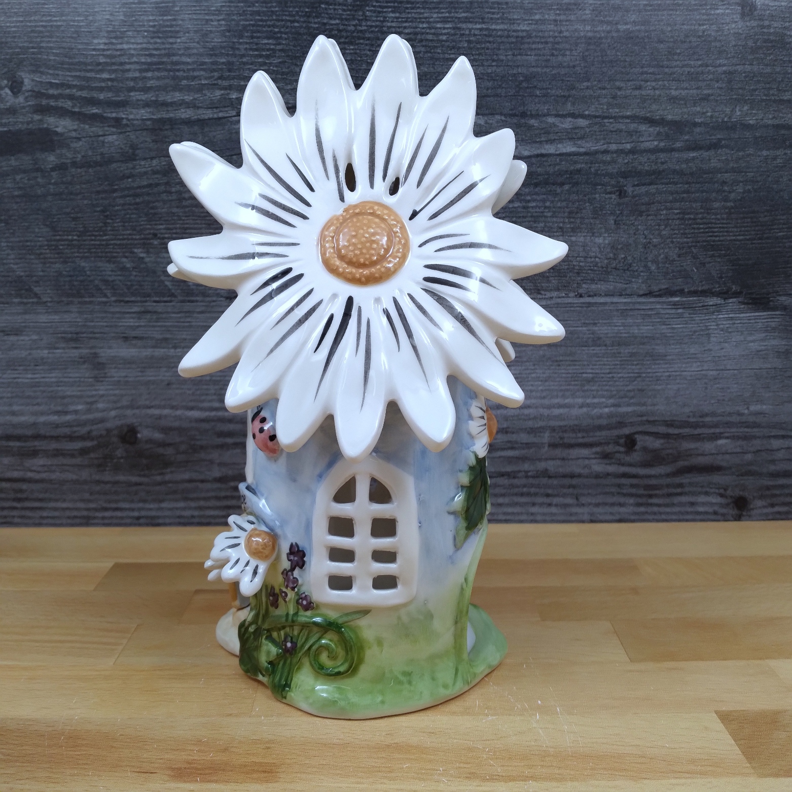 This Blue Daisy Candle House In Full Bloom By Blue Sky Heather Goldminic is made with love by Premier Homegoods! Shop more unique gift ideas today with Spots Initiatives, the best way to support creators.