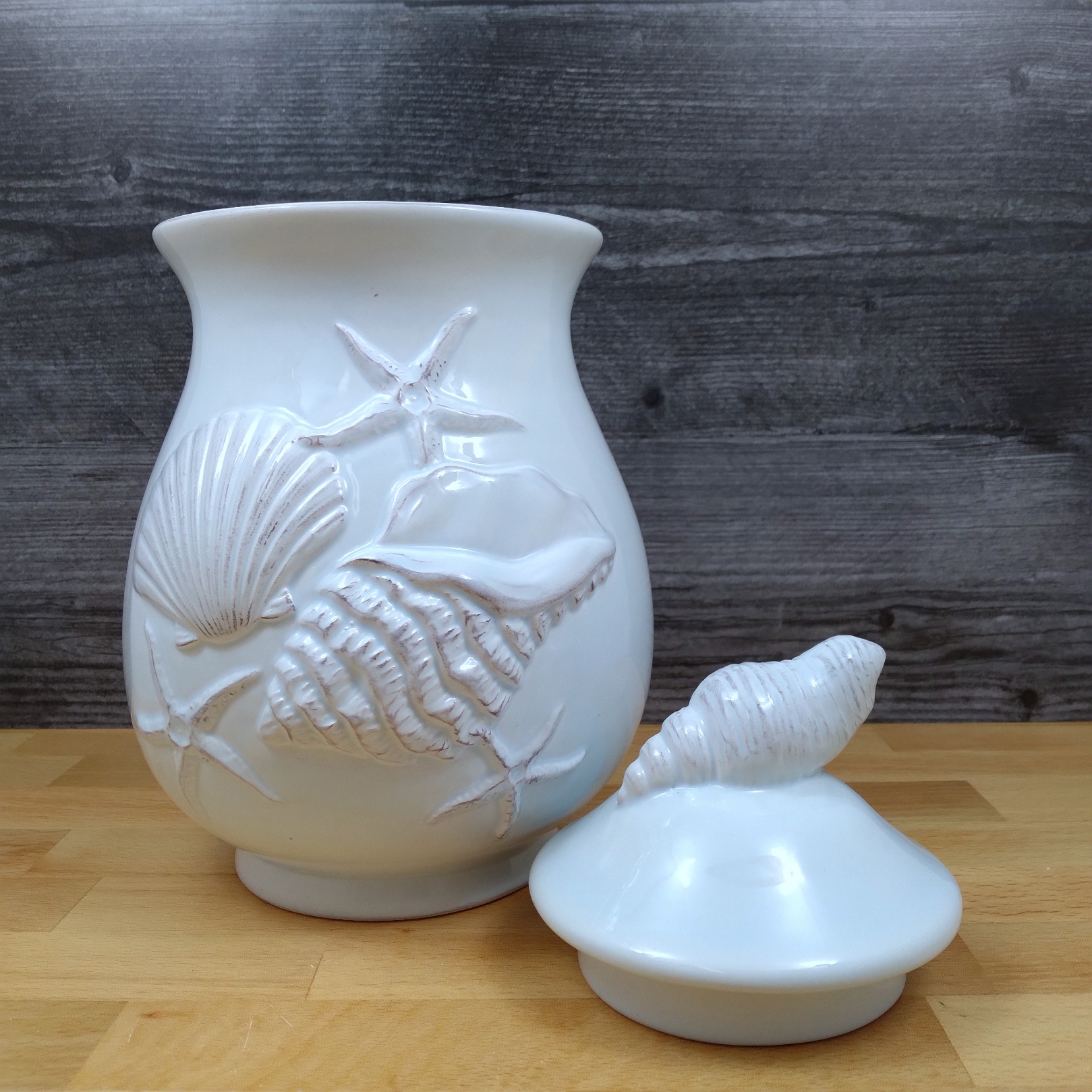 This Laguna Coastal Shell Canister 9" Blue Decorative Sea Life Jug by Blue Sky is made with love by Premier Homegoods! Shop more unique gift ideas today with Spots Initiatives, the best way to support creators.