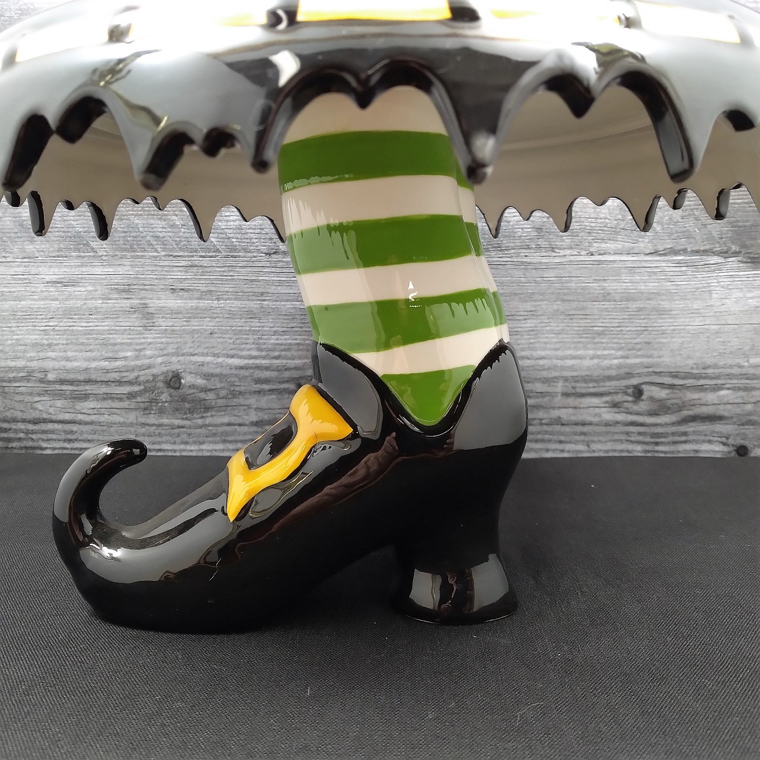This Halloween Witch Feet Cake Stand by Blue Sky Clayworks and Heather Goldminic is made with love by Premier Homegoods! Shop more unique gift ideas today with Spots Initiatives, the best way to support creators.