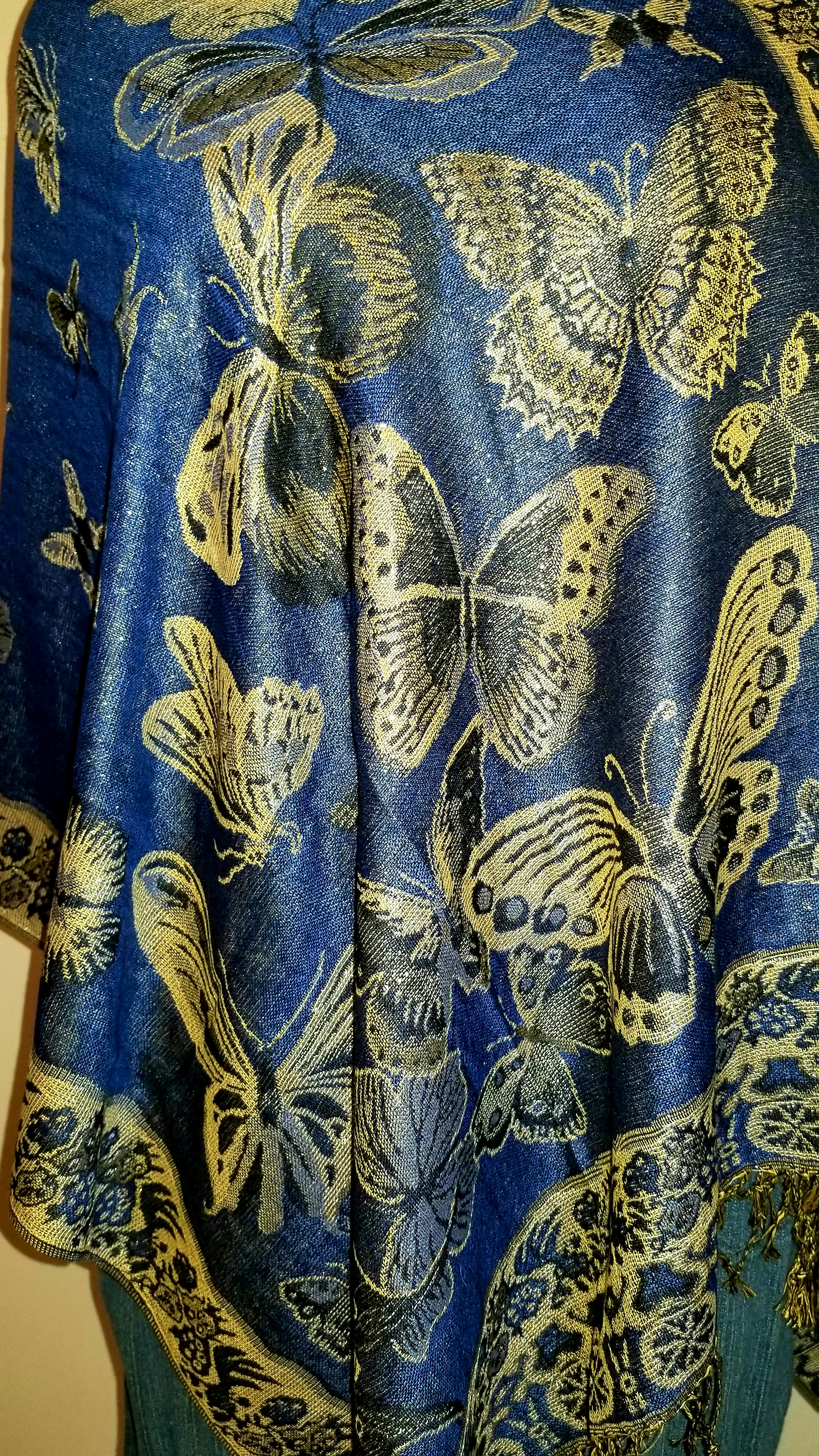 This Butterflies in Royal Blue and Gold Popover Reversible Shawlmina Shawl- Silk Blend - Fits most is made with love by The Creative Soul Sisters! Shop more unique gift ideas today with Spots Initiatives, the best way to support creators.