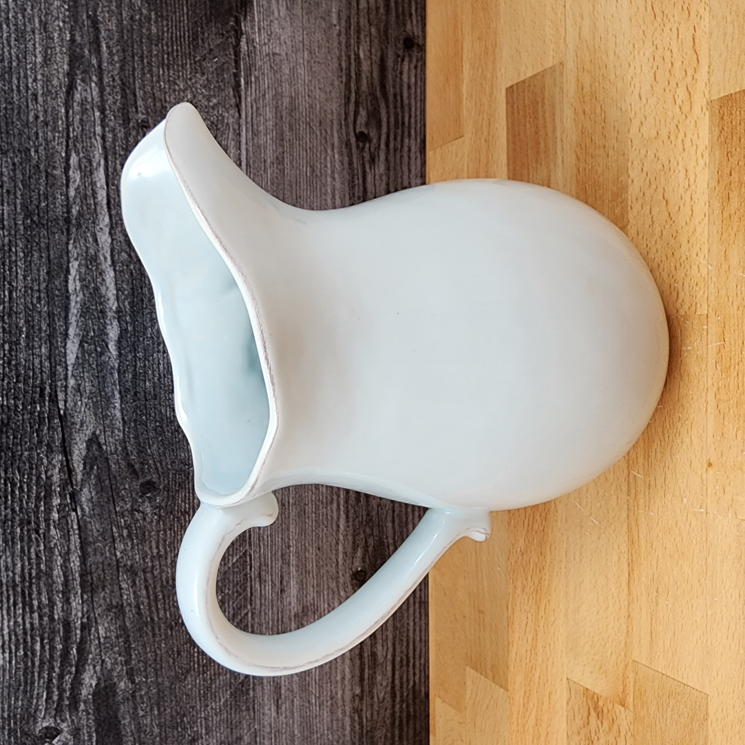 This Blue Laguna Pitcher Embossed Shells Decorative Ocean Sea Life by Blue Sky is made with love by Premier Homegoods! Shop more unique gift ideas today with Spots Initiatives, the best way to support creators.
