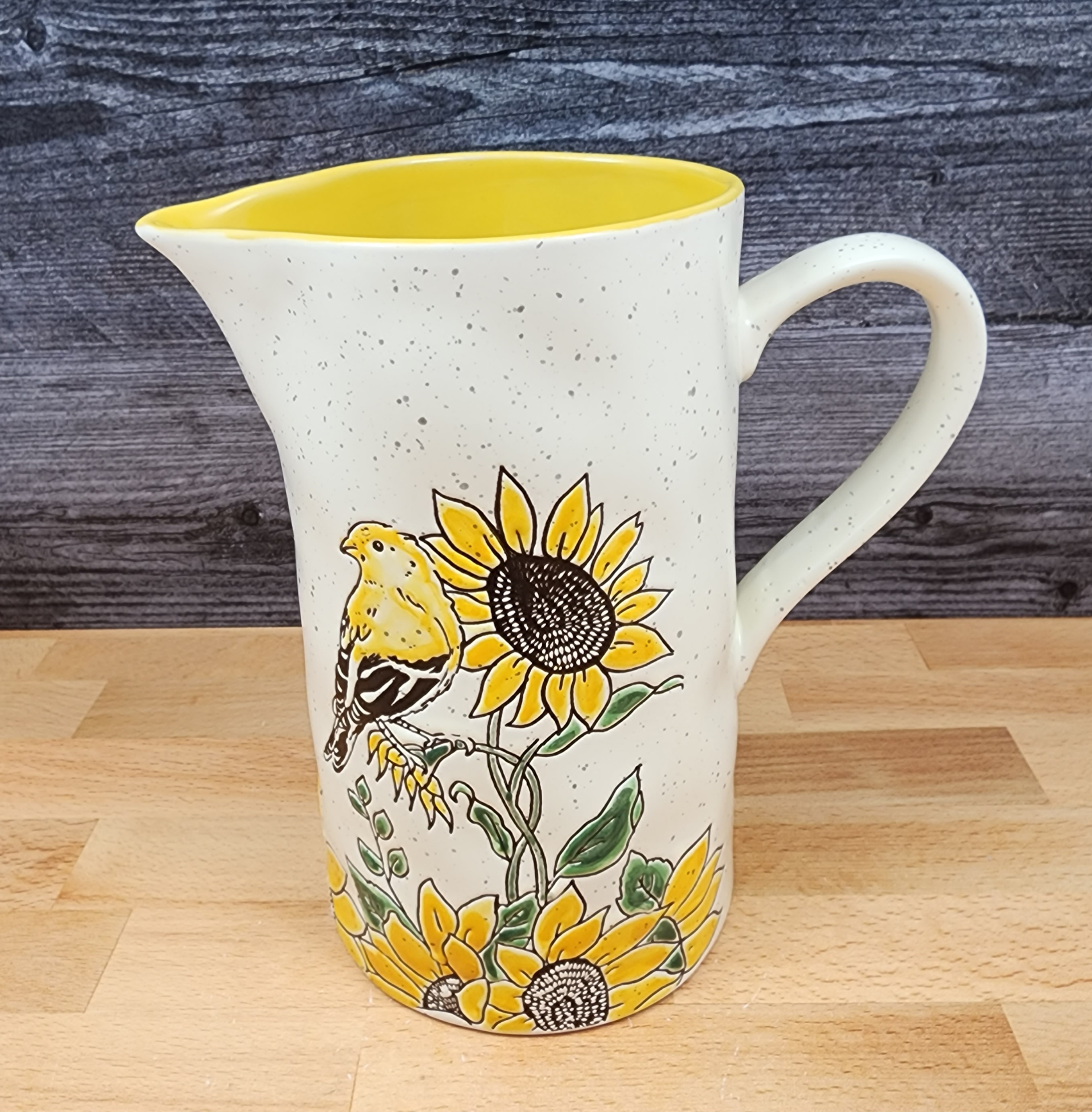 This Sunflower and Yellow Bird Embossed Pitcher Decorative Floral Home by Blue Sky is made with love by Premier Homegoods! Shop more unique gift ideas today with Spots Initiatives, the best way to support creators.