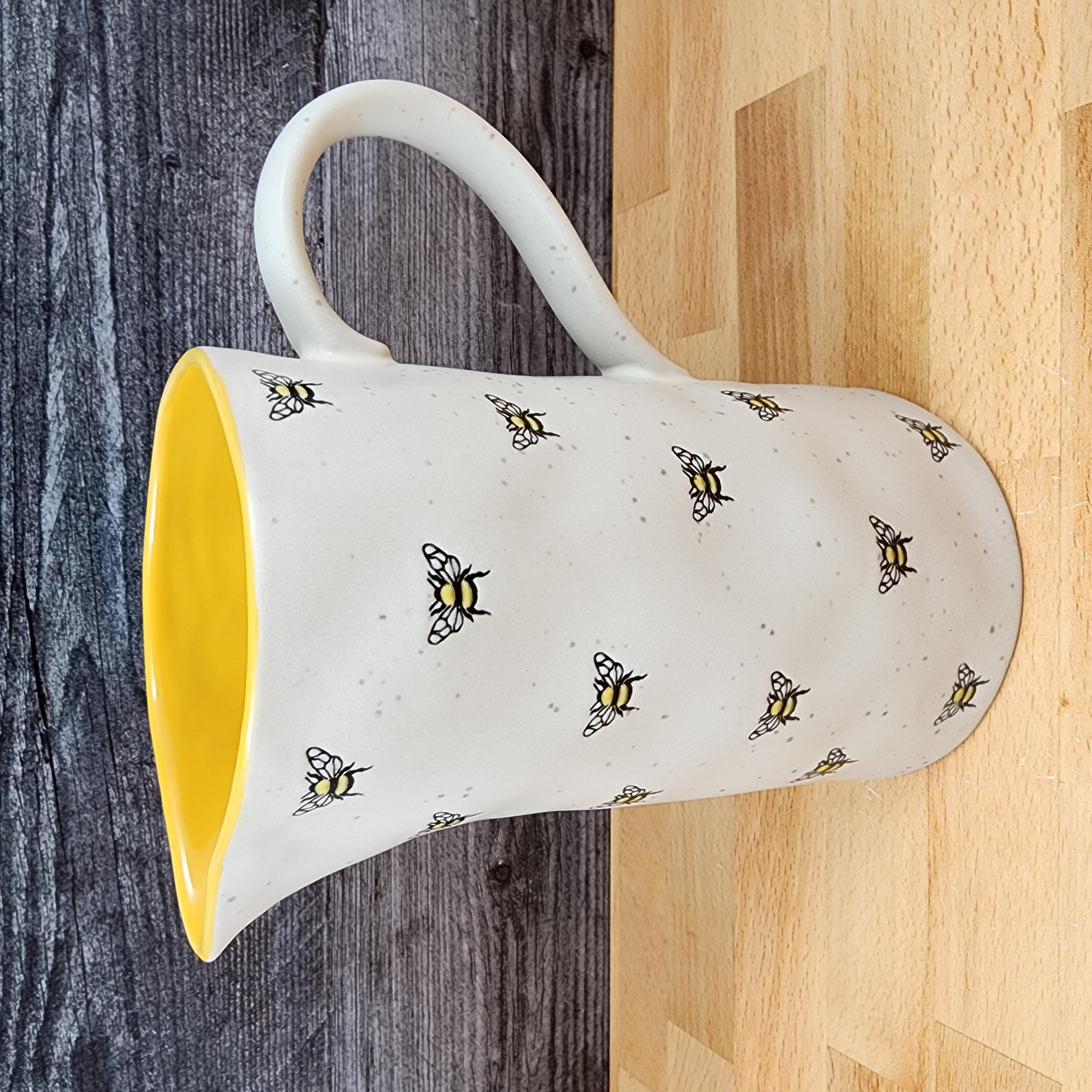 This Honey Bee Embossed Pitcher Decorative Home Canister by Blue Sky is made with love by Premier Homegoods! Shop more unique gift ideas today with Spots Initiatives, the best way to support creators.