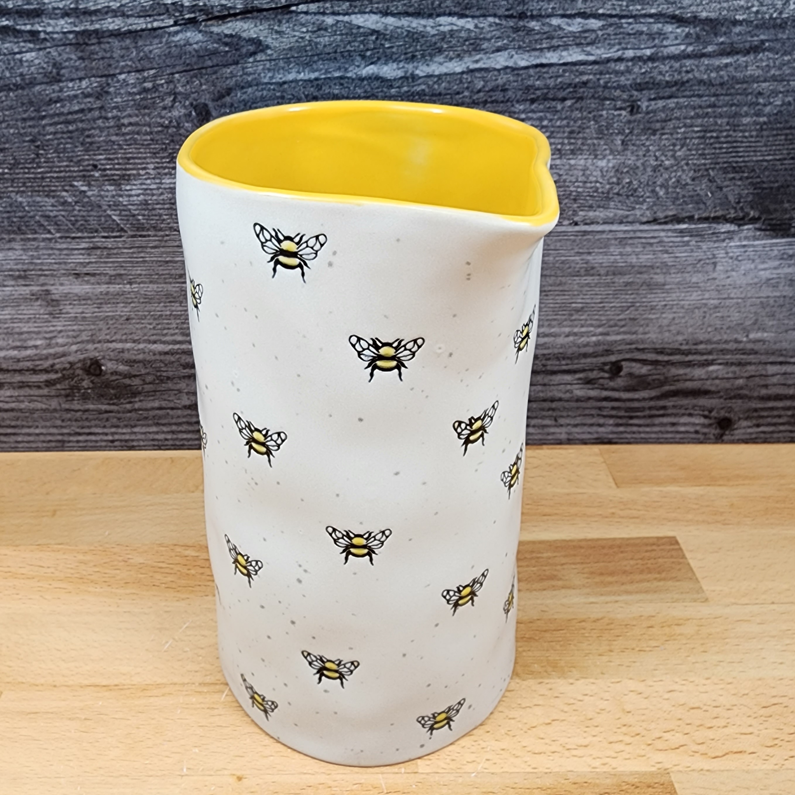 This Honey Bee Embossed Pitcher Decorative Home Canister by Blue Sky is made with love by Premier Homegoods! Shop more unique gift ideas today with Spots Initiatives, the best way to support creators.