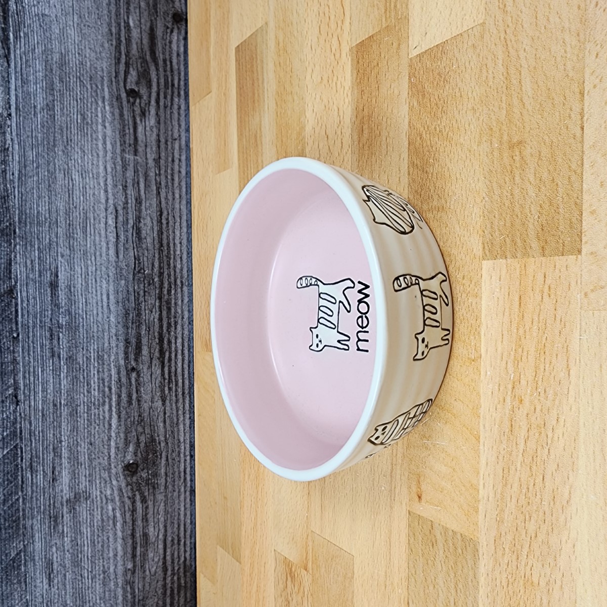 This Cat Water or Food Bowl Embossed Treat Dish in Pink and White By Blue Sky is made with love by Premier Homegoods! Shop more unique gift ideas today with Spots Initiatives, the best way to support creators.