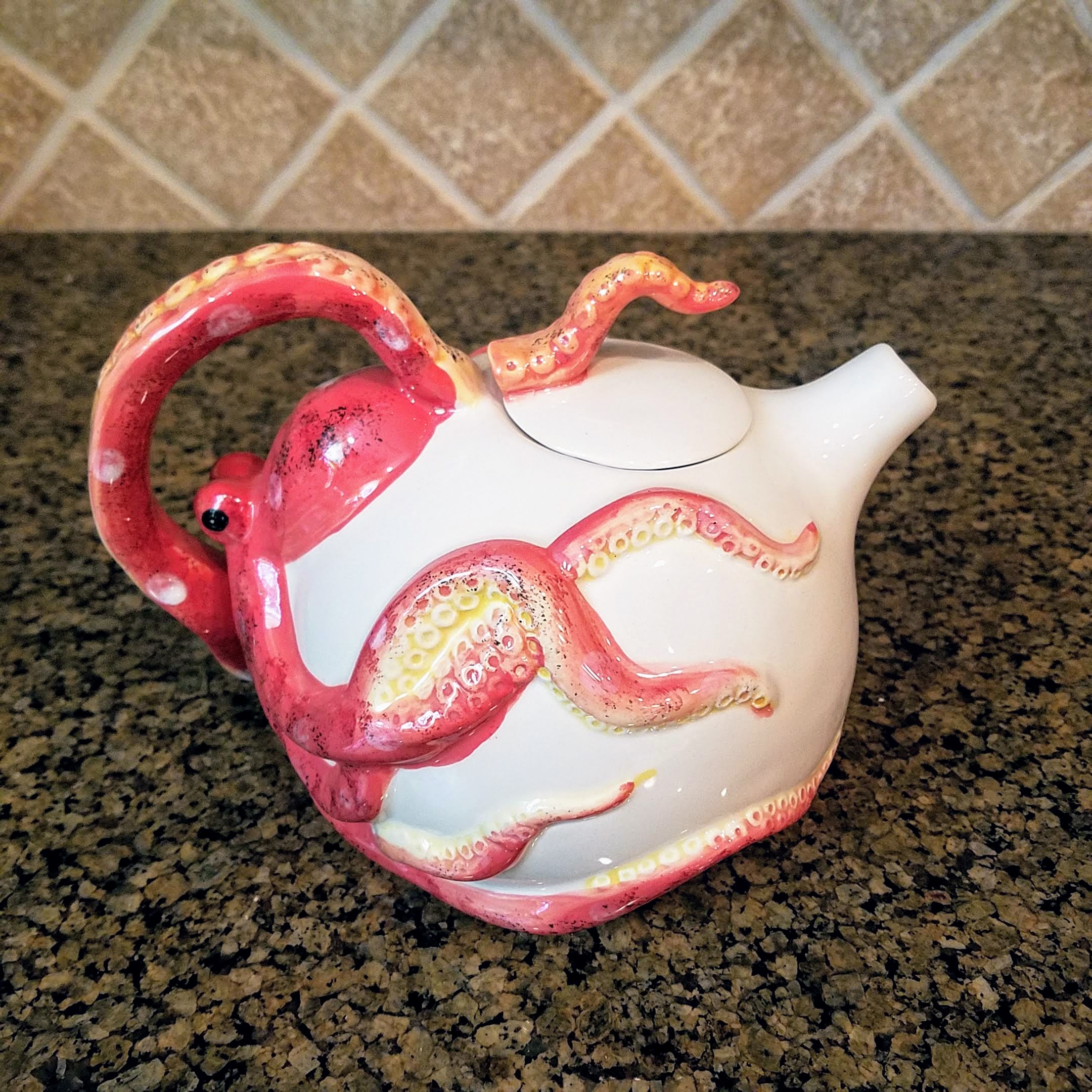 This Octopus Teapot Red Sea Decorative Collectable Kitchen Decor by Blue Sky is made with love by Premier Homegoods! Shop more unique gift ideas today with Spots Initiatives, the best way to support creators.