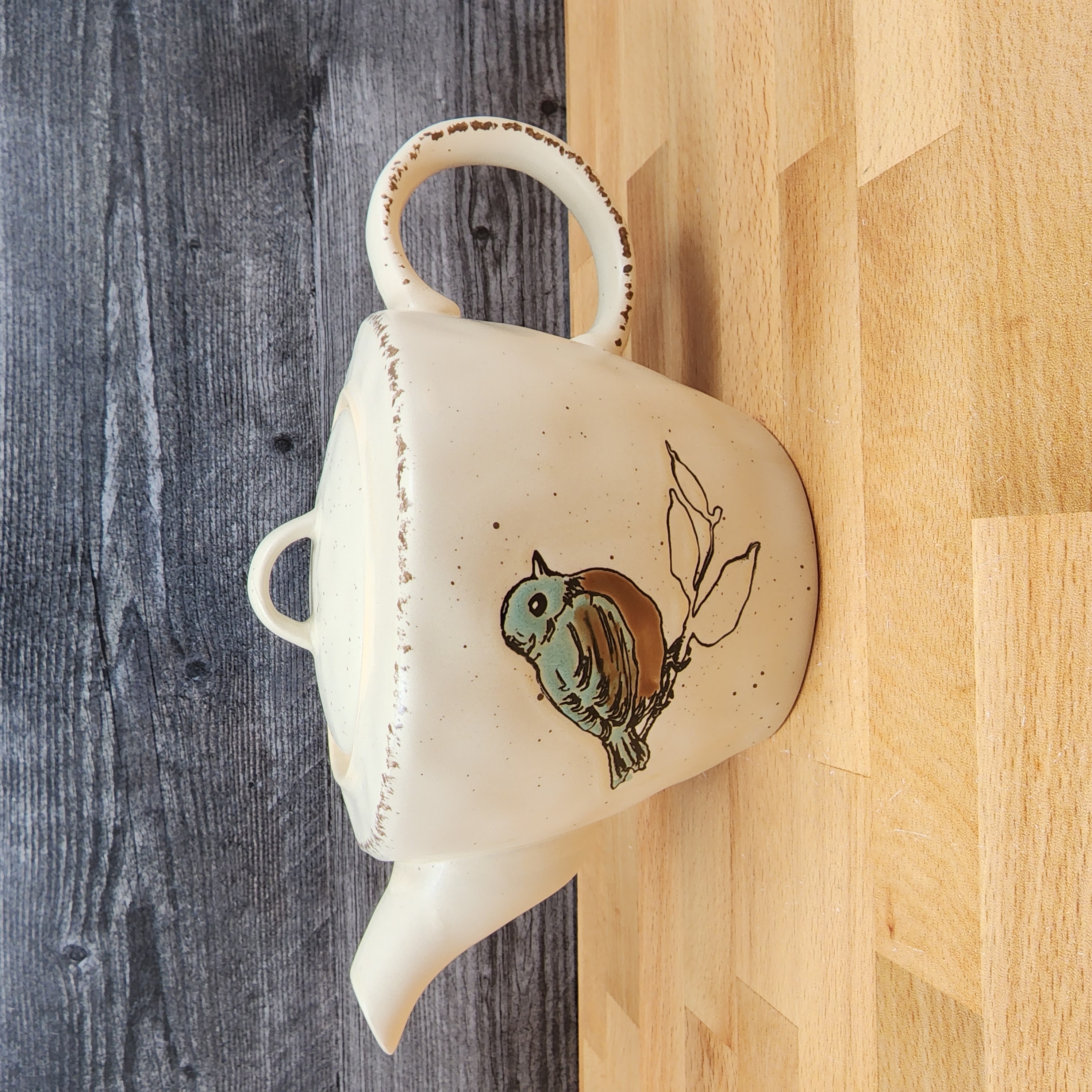 This Embossed Bird Teapot Kitchen Decorative Collectable by Blue Sky is made with love by Premier Homegoods! Shop more unique gift ideas today with Spots Initiatives, the best way to support creators.