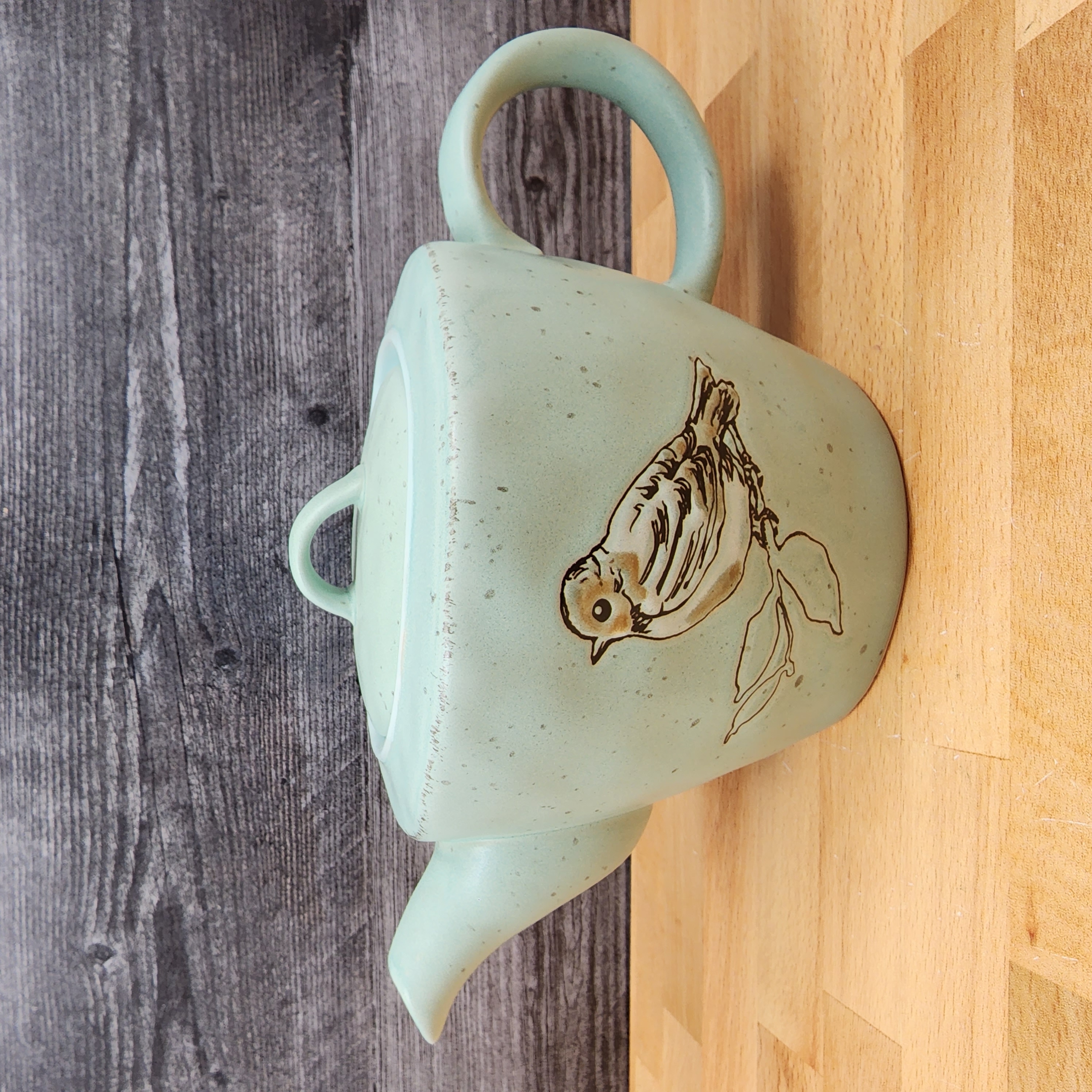 This Bird Embossed Teapot Kitchen Decorative Collectable by Blue Sky is made with love by Premier Homegoods! Shop more unique gift ideas today with Spots Initiatives, the best way to support creators.