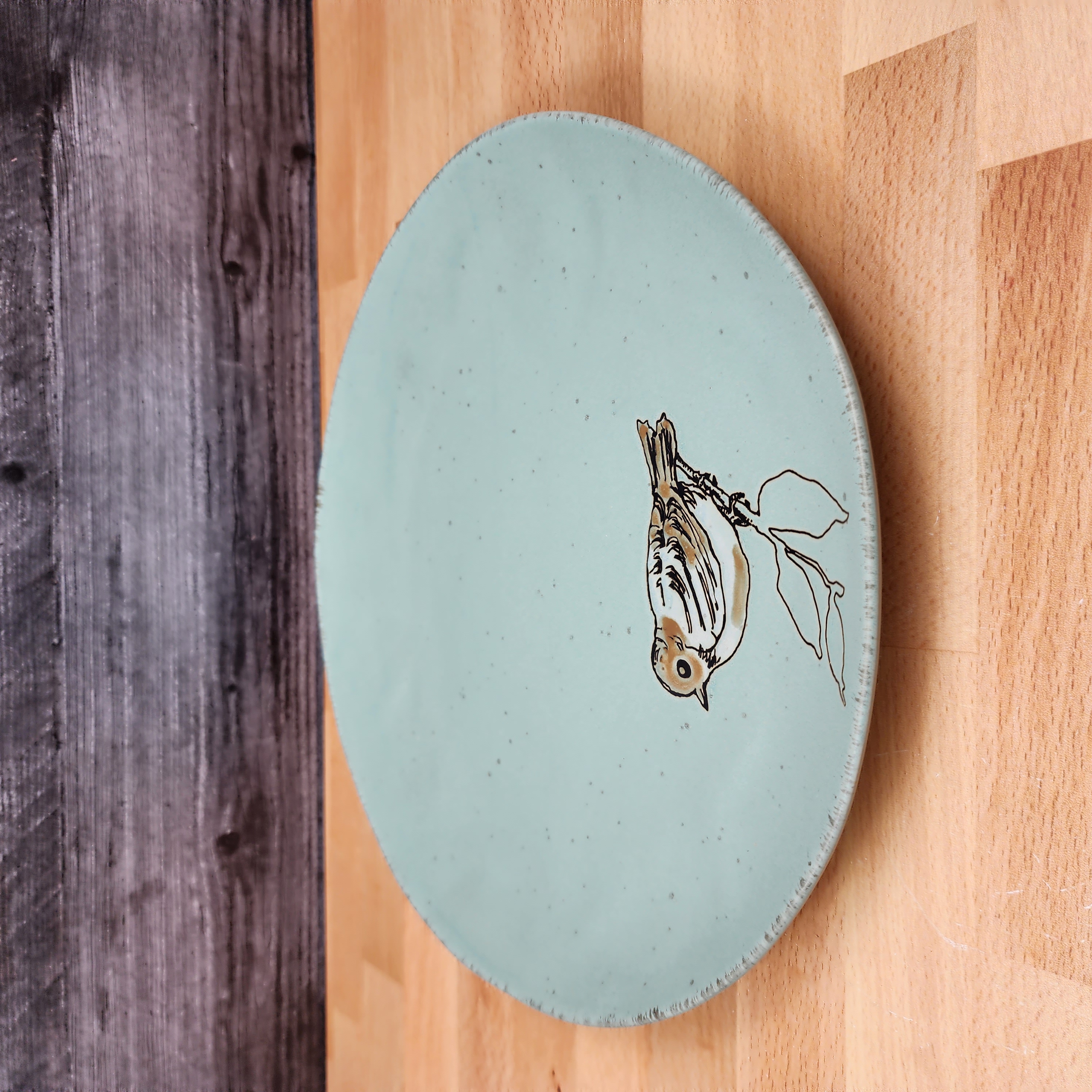 This Bird Embossed Dinner Plate 10" (27cm) Decorative Aqua Color Blue Sky Clayworks is made with love by Premier Homegoods! Shop more unique gift ideas today with Spots Initiatives, the best way to support creators.