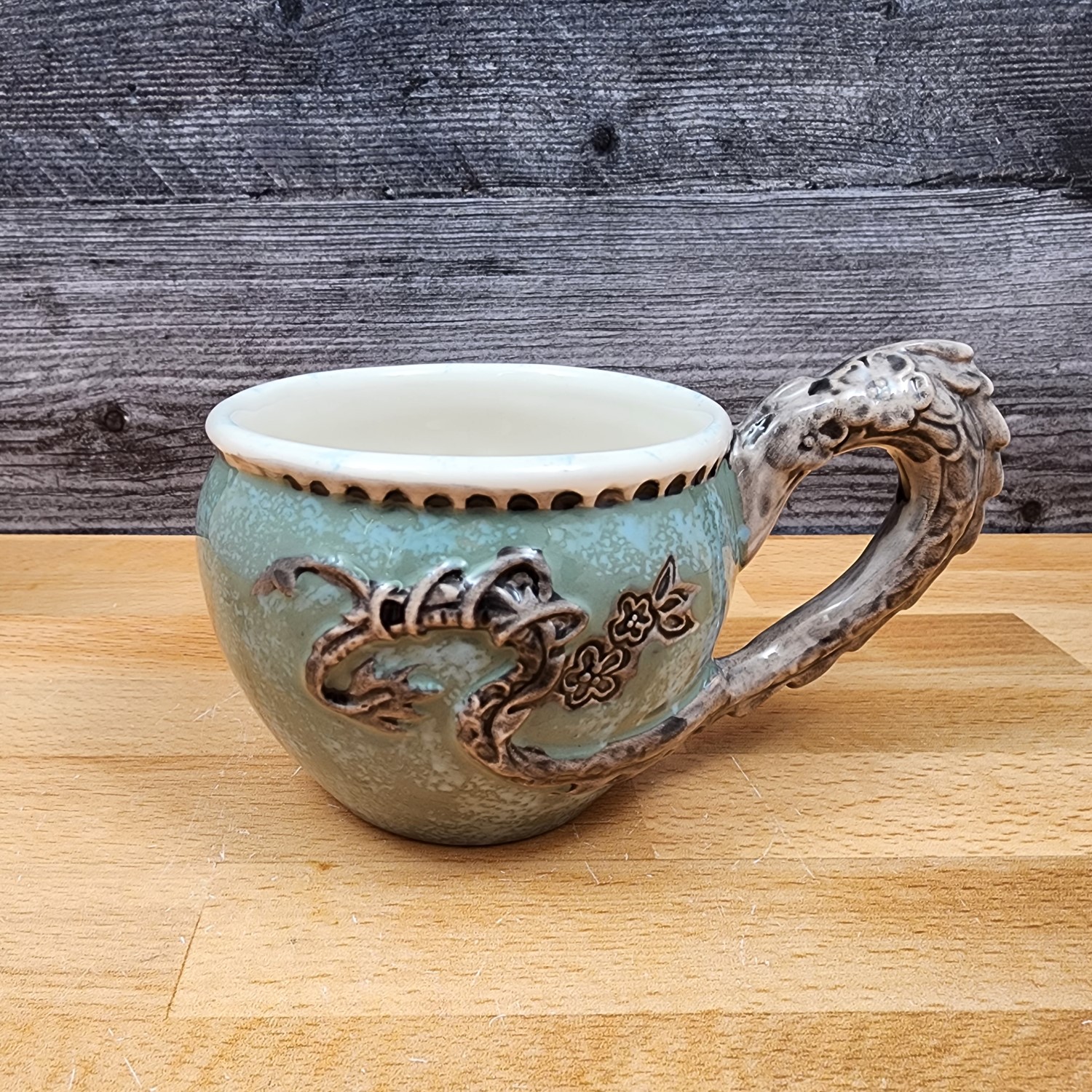 This Green Dragon Decorative Coffee Mug by Blue Sky Heather Goldminic Tea Cup is made with love by Premier Homegoods! Shop more unique gift ideas today with Spots Initiatives, the best way to support creators.