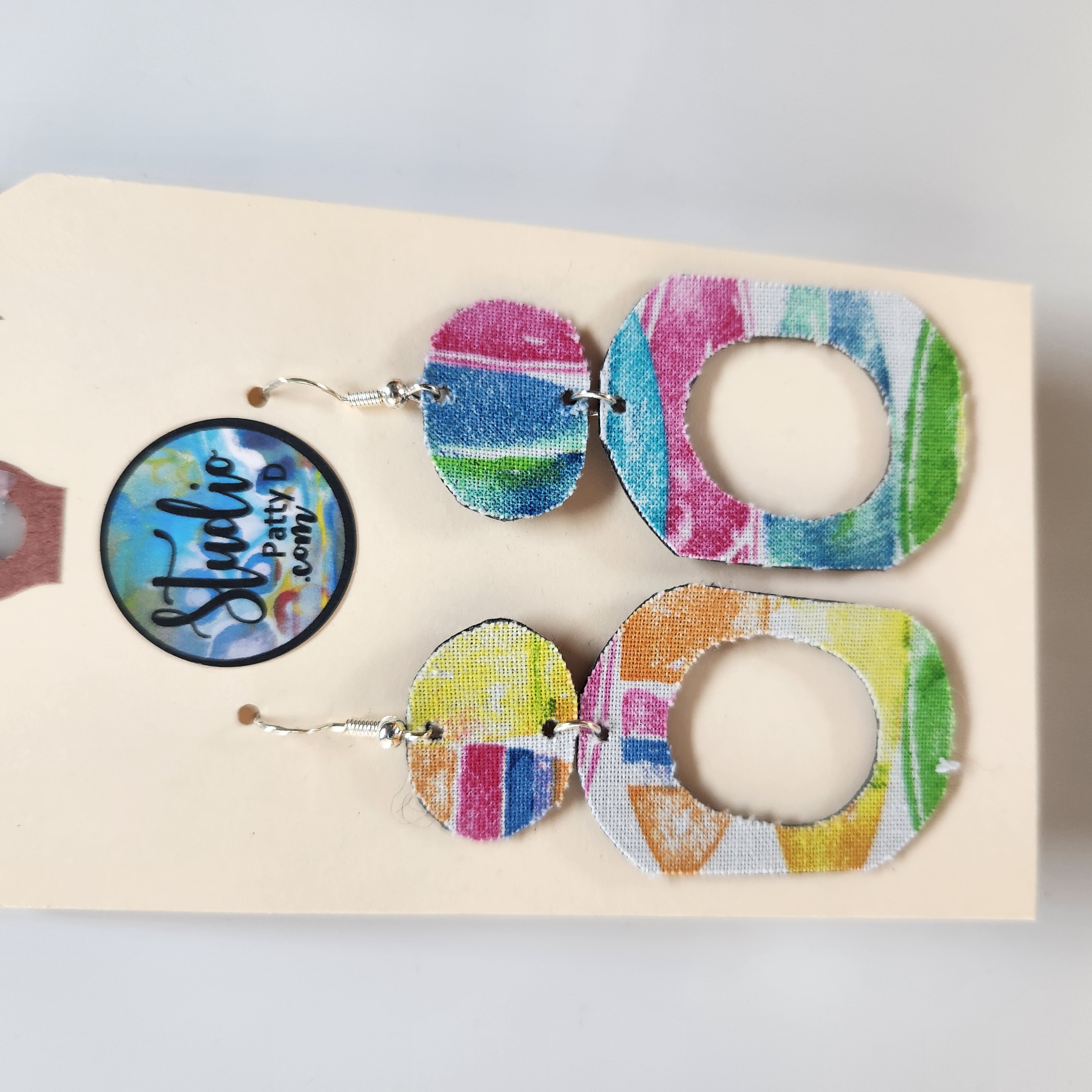This Fishhook Pierced Earrings - Rainbow colors drop oval hoop is made with love by Studio Patty D! Shop more unique gift ideas today with Spots Initiatives, the best way to support creators.