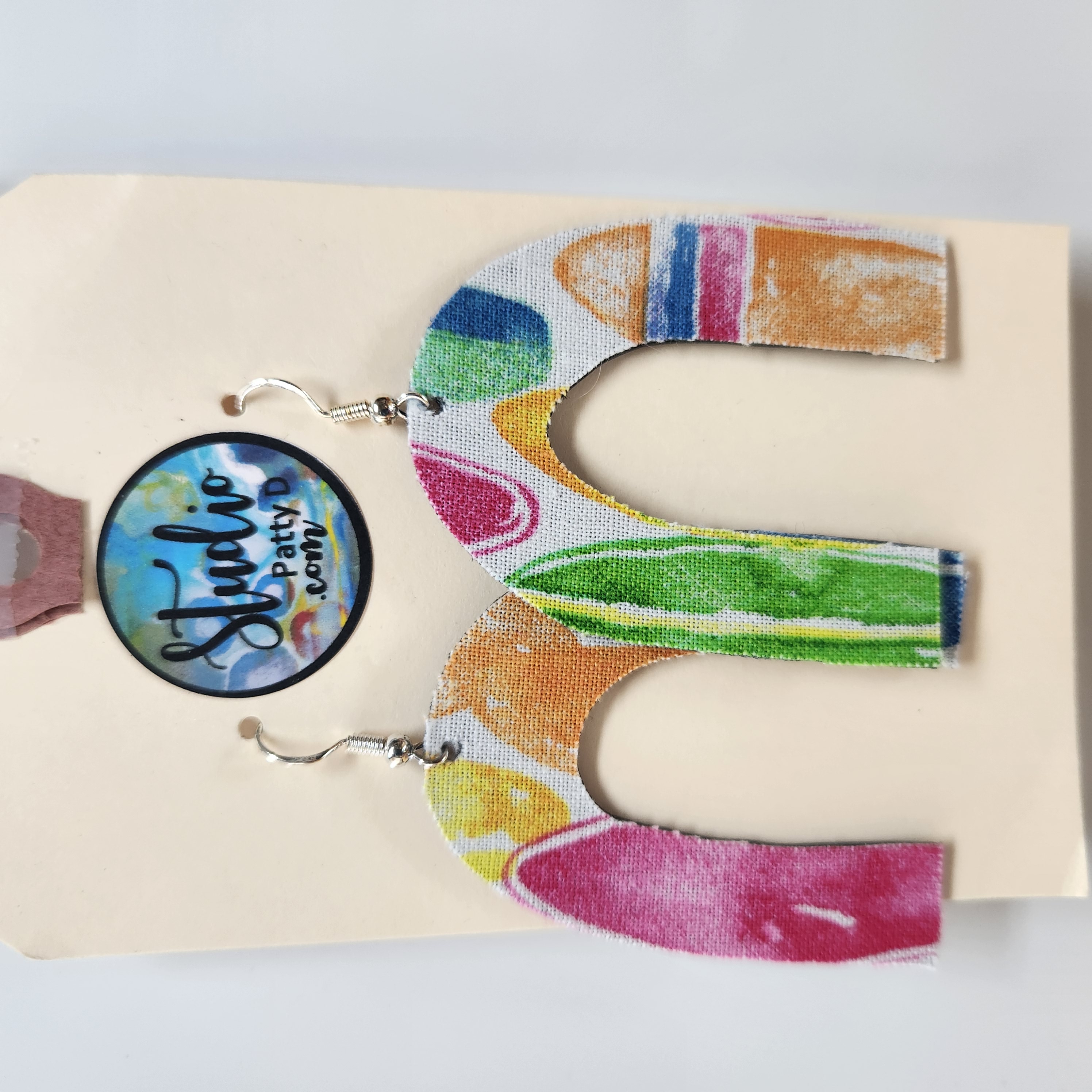 This Fishhook Pierced Earrings - colorful arches is made with love by Studio Patty D! Shop more unique gift ideas today with Spots Initiatives, the best way to support creators.