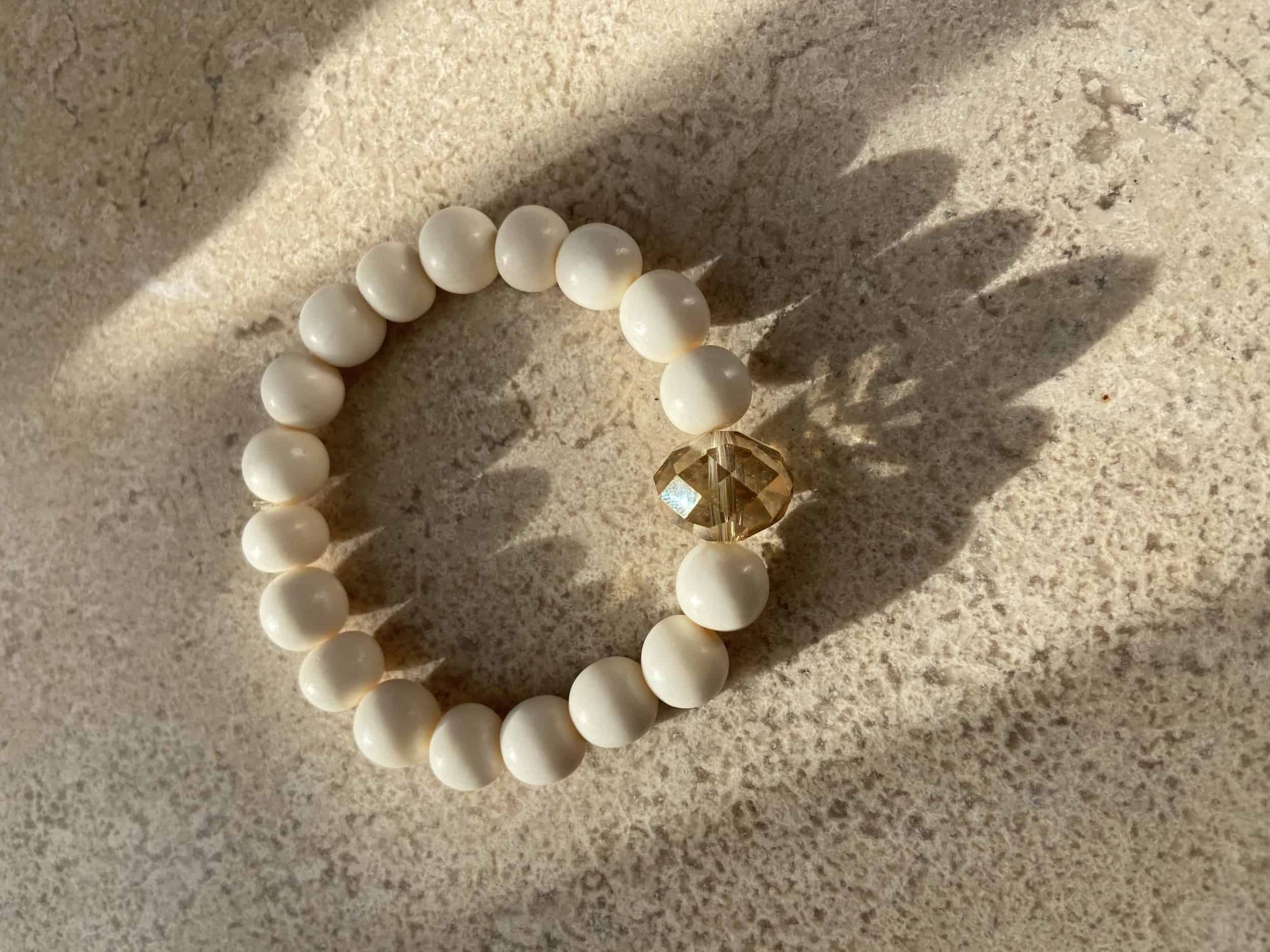 This Ivory and Crystal Bead Stretchy Bracelet is made with love by Adelu Jewelry! Shop more unique gift ideas today with Spots Initiatives, the best way to support creators.