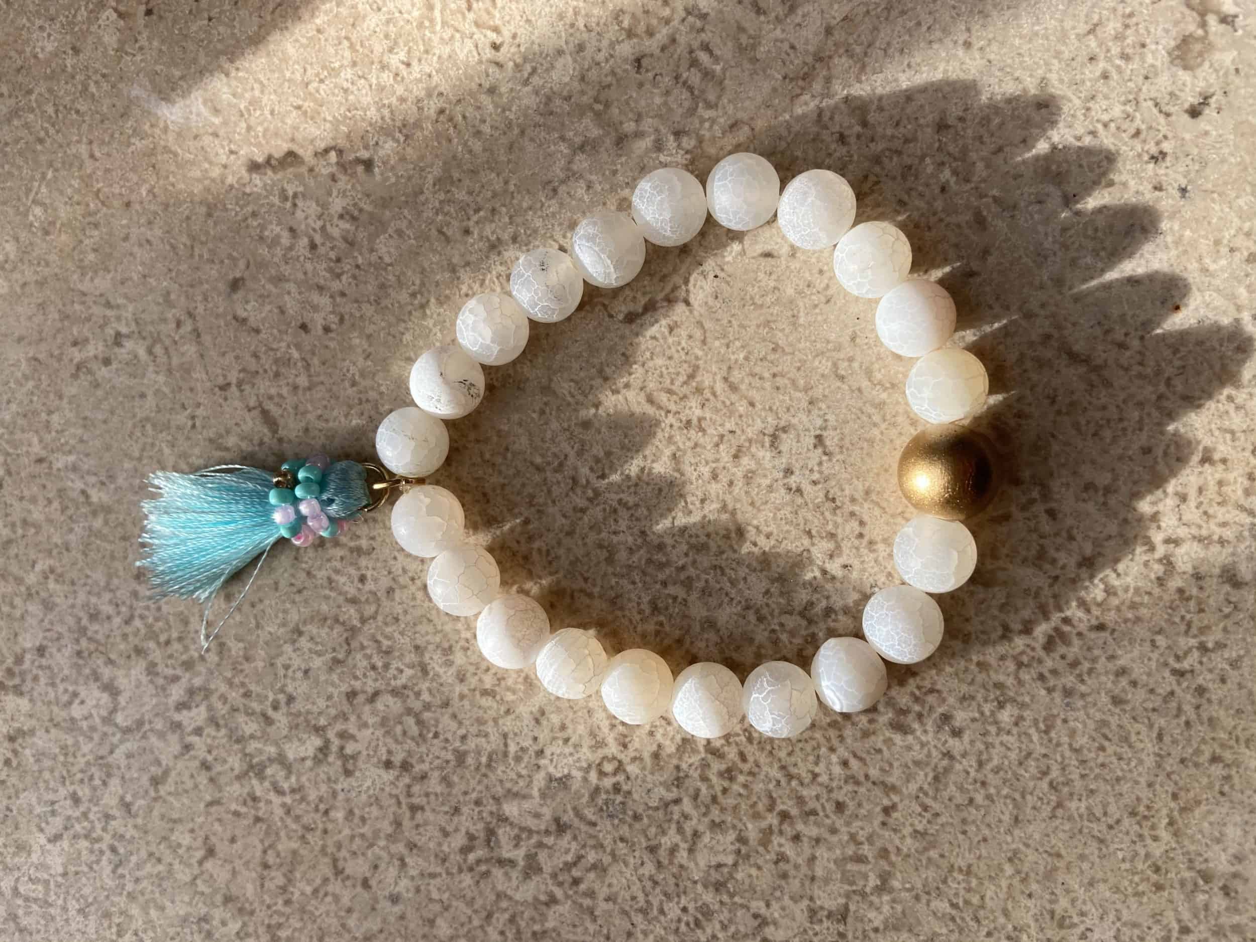 This White Stretchy with Turquoise Tassel Bracelet is made with love by Adelu Jewelry! Shop more unique gift ideas today with Spots Initiatives, the best way to support creators.