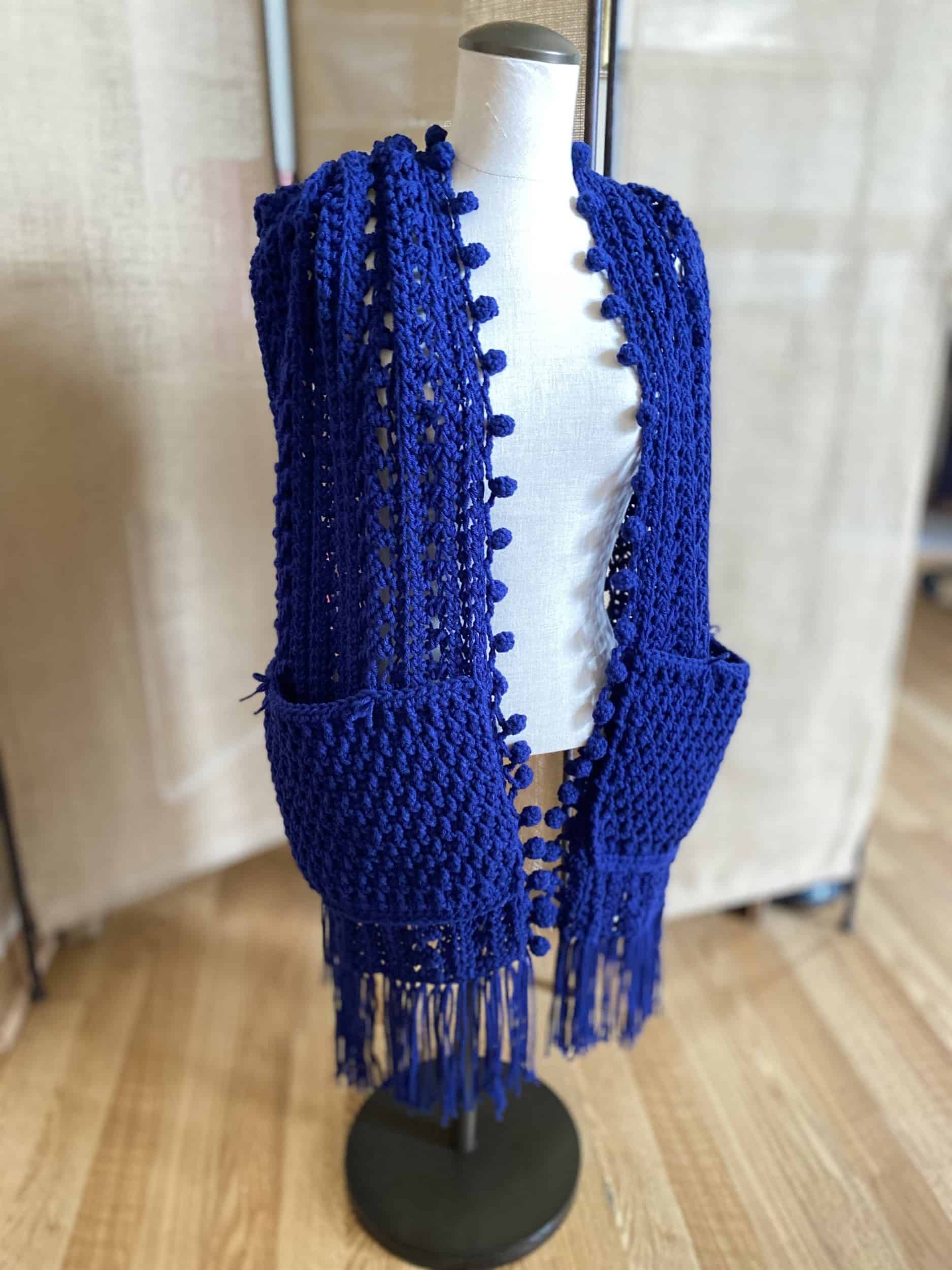 This Crochet Pocket Shawl Scarf is made with love by Classy Crafty Wife! Shop more unique gift ideas today with Spots Initiatives, the best way to support creators.