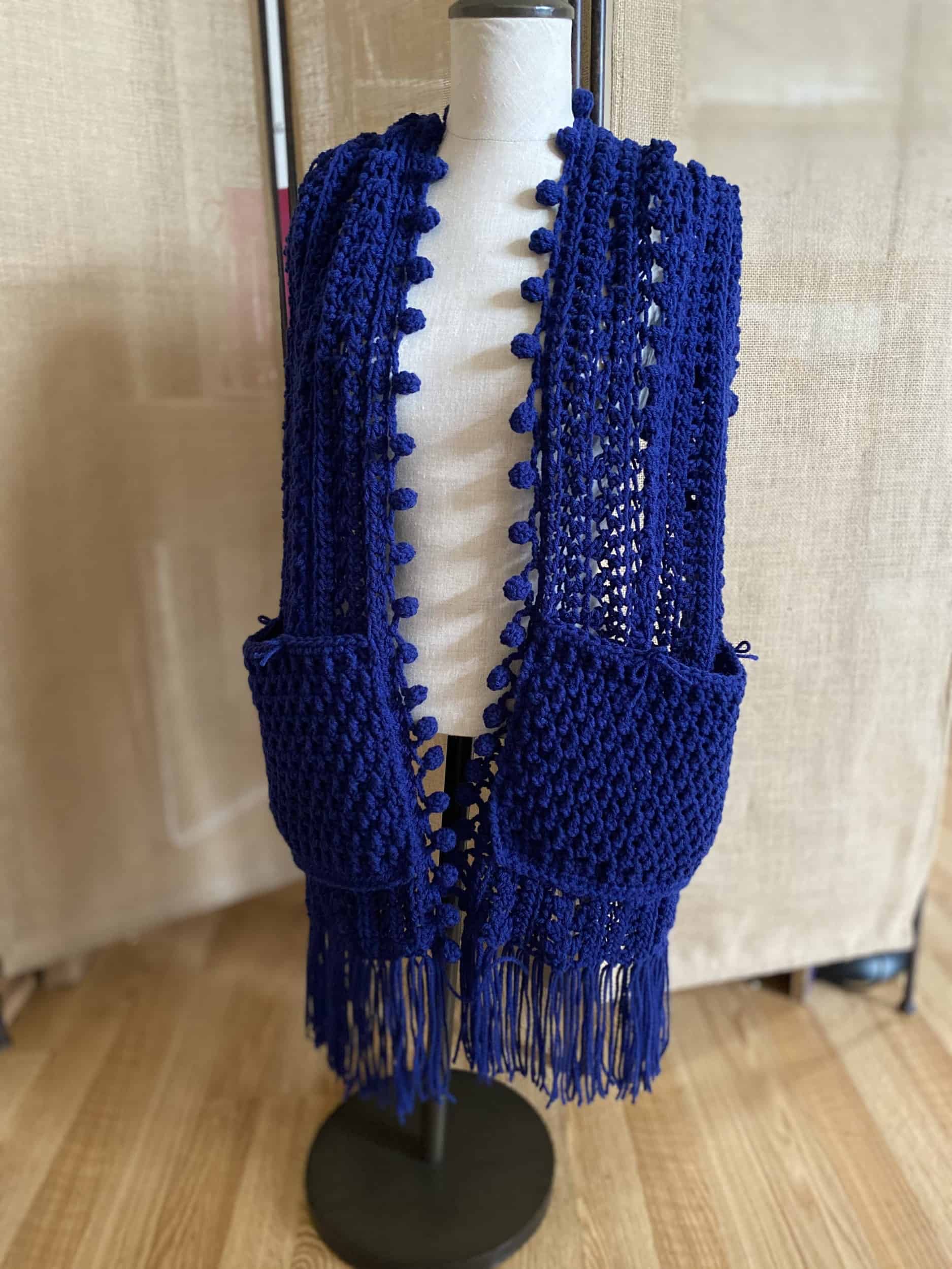 This Crochet Pocket Shawl Scarf is made with love by Classy Crafty Wife! Shop more unique gift ideas today with Spots Initiatives, the best way to support creators.