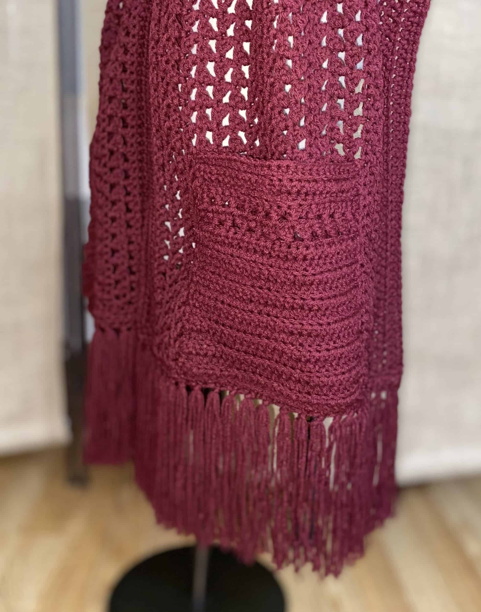 This Crochet Pocket Shawl is made with love by Classy Crafty Wife! Shop more unique gift ideas today with Spots Initiatives, the best way to support creators.