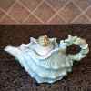 This Shell Teapot Blue Decorative Sea Life Home Decor by Blue Sky is made with love by Premier Homegoods! Shop more unique gift ideas today with Spots Initiatives, the best way to support creators.