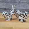 This Zebra Salt Pepper Set Collectible Decorative Lynda Corneille Blue Sky Clayworks is made with love by Premier Homegoods! Shop more unique gift ideas today with Spots Initiatives, the best way to support creators.