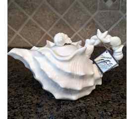 This Shell Teapot White Collectible Decorative Sea Life Home Decor by Blue Sky is made with love by Premier Homegoods! Shop more unique gift ideas today with Spots Initiatives, the best way to support creators.