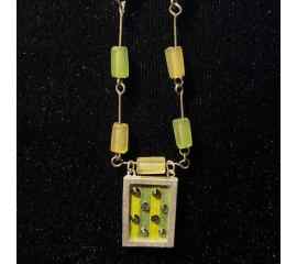 This Rectangle Pendant Jewelry Art Black Yellow Green Silver With Swarovski Crystals is made with love by Premier Homegoods! Shop more unique gift ideas today with Spots Initiatives, the best way to support creators.