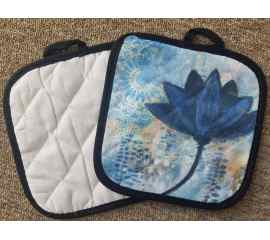 This Pot Holder - Blue Lotus w-black trim is made with love by Studio Patty D! Shop more unique gift ideas today with Spots Initiatives, the best way to support creators.