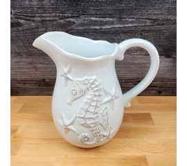 This Blue Laguna Pitcher Embossed Shells Decorative Ocean Sea Life by Blue Sky is made with love by Premier Homegoods! Shop more unique gift ideas today with Spots Initiatives, the best way to support creators.