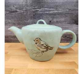 This Bird Embossed Teapot Kitchen Decorative Collectable by Blue Sky is made with love by Premier Homegoods! Shop more unique gift ideas today with Spots Initiatives, the best way to support creators.