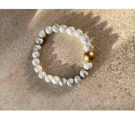 This White and Gray stretchy Bracelet is made with love by Adelu Jewelry! Shop more unique gift ideas today with Spots Initiatives, the best way to support creators.