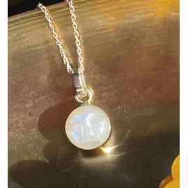This Moon goddess-Tiny  Moonstone carved moon face necklace by earth karma is made with love by EARTH KARMA! Shop more unique gift ideas today with Spots Initiatives, the best way to support creators.