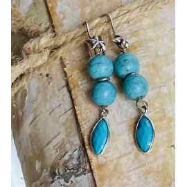 This Blue Turquoise dangly earrings in sterling silver  by Earth Karma is made with love by EARTH KARMA! Shop more unique gift ideas today with Spots Initiatives, the best way to support creators.