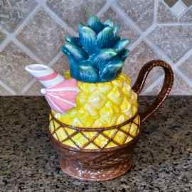 This Pinapple Floral Teapot Kitchen Decorative Collectable Flower Blue Sky Goldminic is made with love by Premier Homegoods! Shop more unique gift ideas today with Spots Initiatives, the best way to support creators.