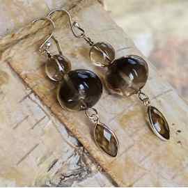 This Smokey quartz brown dangly earrings by Earth Karma is made with love by EARTH KARMA! Shop more unique gift ideas today with Spots Initiatives, the best way to support creators.
