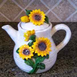 This Sunflower Teapot Ceramic Kitchen Decorative Collectable Blue Sky Goldminic is made with love by Premier Homegoods! Shop more unique gift ideas today with Spots Initiatives, the best way to support creators.
