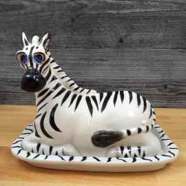 This Zebra Butter Dish Ceramic by Blue Sky Lynda Corneille is made with love by Premier Homegoods! Shop more unique gift ideas today with Spots Initiatives, the best way to support creators.