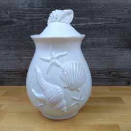 This Laguna Coastal Shell Canister 8" Blue Decorative Sea Life Jug by Blue Sky is made with love by Premier Homegoods! Shop more unique gift ideas today with Spots Initiatives, the best way to support creators.